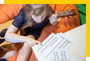 girl playing guitar