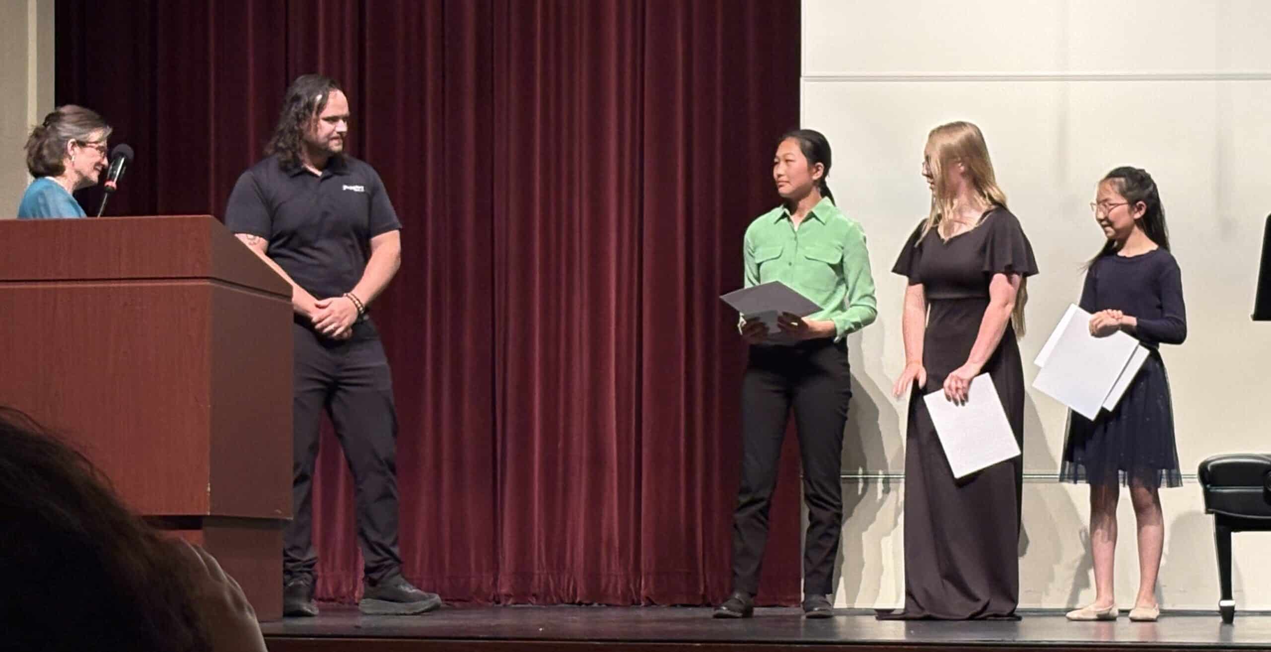 Popplers Competitions winners with Josh Gratton, owner of Popplers Music and Dianna Anderson, President of Minot MTA